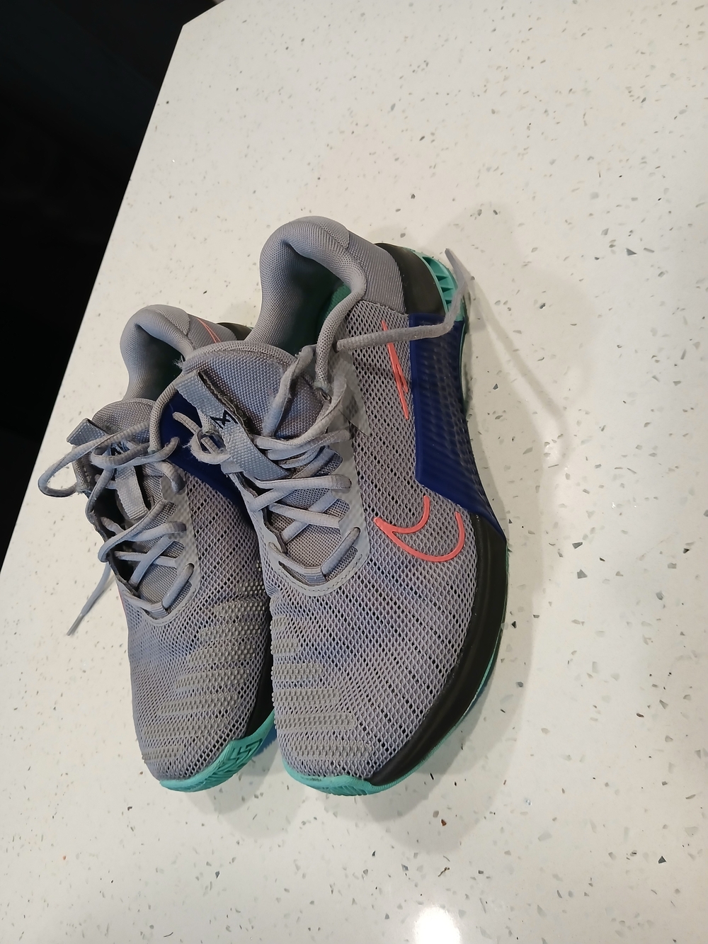 Nike Gray Sneakers with Coral Swoosh and Teal Outsole